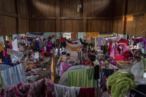 A woman is seen in a cramped relief center for displaced Meitei community in Moirang, near Imphal, capital of the northeastern Indian state of Manipur, Wednesday, June 21, 2023. Manipur state is caught in a deadly conflict between two ethnic communities that have armed themselves and launched brutal attacks against one another. At least 120 people have been killed since May. (AP Photo/Altaf Qadri)