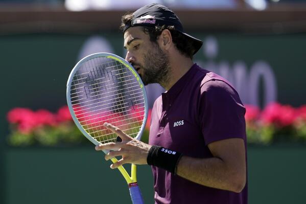 Matteo Berrettini, of Italy, reacts after a missed shot against Miomir Kecmanovic, of Serbia, at the BNP Paribas Open tennis tournament Wednesday, March 16, 2022, in Indian Wells, Calif. (AP Photo/Marcio Jose Sanchez)