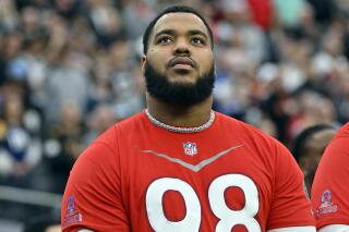 FILE - AFC defensive tackle Jeffery Simmons, of the Tennessee Titans, stands for the national anthem before the flag football event at the NFL Pro Bowl, Feb. 5, 2023, in Las Vegas. A person familiar with the deal says the Titans agreed Friday, April 7, 2023, to a four-year contract extension with Simmons. The person confirmed the extension on condition of anonymity to The Associated Press because the Titans had not announced the deal. (AP Photo/David Becker, File)
