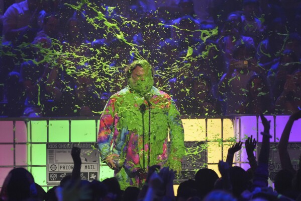 Jack Black gets slimed while accepting the award for king of comedy during the Nickelodeon Kids' Choice Awards on Saturday, June 21, 2025, at The Barker Hangar in Santa Monica, Calif. (AP Photo/Chris Pizzello)