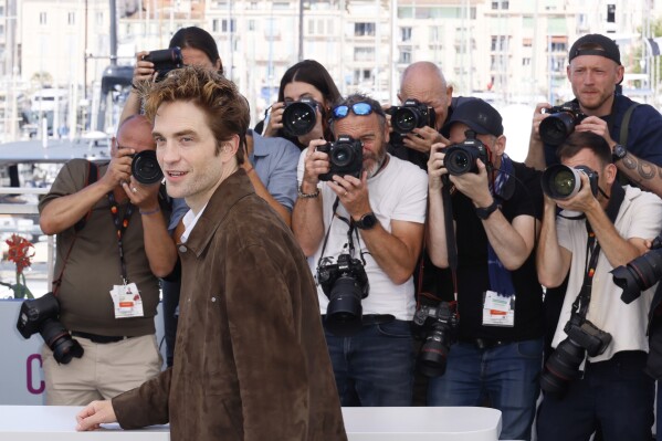 Robert Pattinson poses for photographers at the photo call for the film 'Die, My Love' at the 78th international film festival, Cannes, southern France, Sunday, May 18, 2025. (Photo by Joel C Ryan/Invision/AP)