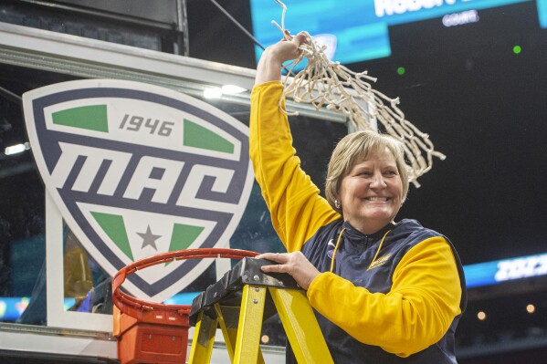 FILE - Toledo head coach Tricia Cullop celebrates after after defeating Bowling Green in an NCAA college basketball game in the championship of the Mid-American Conference Tournament in Cleveland, Saturday, March 11, 2023. Miami is finalizing an agreement to bring Toledo women's basketball coach Tricia Cullop to the Hurricanes as the replacement for the retired Katie Meier, a person with knowledge of the talks said Friday, April 5, 2024.(AP Photo/Phil Long, File)