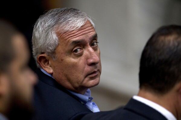 FILE - Guatemalan former President Otto Perez Molina looks over his shoulder during a court hearing in Guatemala City, June 13, 2016. Perez Molina was released from prison Wednesday, Jan. 3, 2024, since his resignation and arrest in 2015 after posting bond. The former president was convicted and sentenced to 16 years in prison in December 2022 for a bribery scheme known locally as “La Linea” or “The Line.” (AP Photo/Moises Castillo, File)