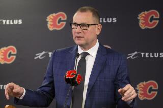 FILE - Calgary Flames general manager Brad Treliving announces the resignation of head coach Bill Peters at an NHL hockey press conference in Calgary, Alberta, Friday, Nov. 29, 2019. Treliving is the new general manager of the Toronto Maple Leafs. The team made the announcement Wednesday, May 31, 2023, less than two weeks after firing Kyle Dubas. (Larry MacDougal/The Canadian Press via AP, File)