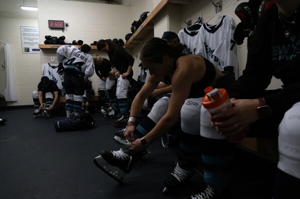 Professional Women's Hockey League New York players get ready for the inaugural PWHL game in Toronto, Monday, Jan. 1, 2024. (AP Photo/Brittany Peterson)