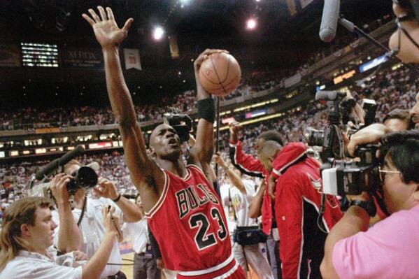 Chicago Bulls Michael Jordan holds the 1991 NBA Finals MVP trophy