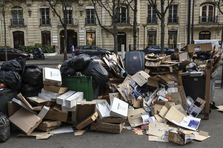FILE - Uncollected garbage is piled up on a street in Paris, March 20, 2023, as strikes continue with uncollected garbage piling higher by the day. (AP Photo/Aurelien Morissard, File)