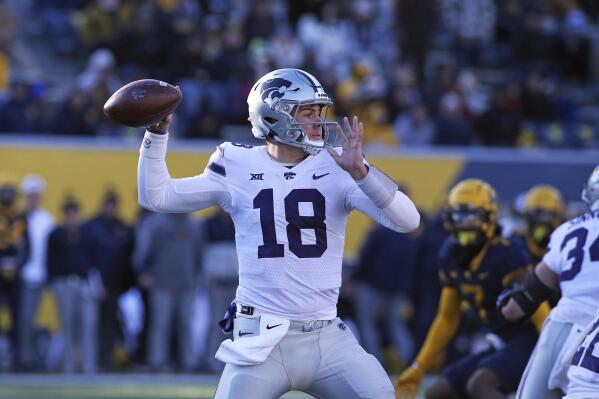 Kansas State quarterback Will Howard (18) passes against West Virginia during the first half of an NCAA college football game in Morgantown, W.Va., Saturday, Nov. 19, 2022. (AP Photo/Kathleen Batten)
