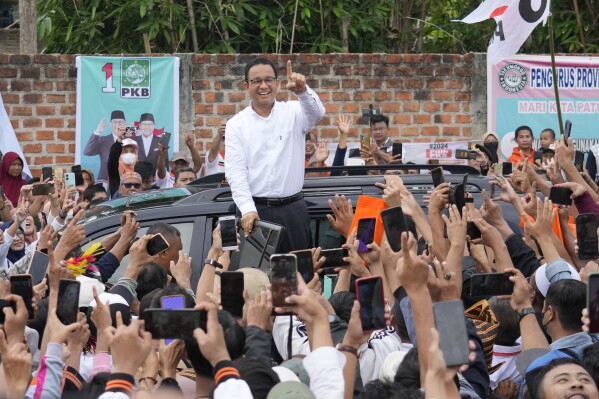 Presidential candidate Anies Baswedan greets supporters during his campaign rally in Bandar Lampung, Indonesia, Sunday, Jan. 14, 2024. The former Jakarta governor seeking Indonesia's presidency said democracy is declining in the country and pledged to make changes to get it back on track. (AP Photo/Achmad Ibrahim)