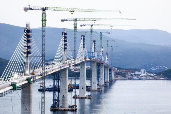A view of the construction of the Peljesac Bridge in Komarna, Croatia, Wednesday, July 28, 2021. European Union-funded Peljesac Bridge in southern Croatia that has been built by a Chinese state-owned company was opened late Wednesday. The bridge was designed to connect two swaths of Adriatic Sea coastline and passes over a small stretch of Bosnia's territory. (AP Photo)