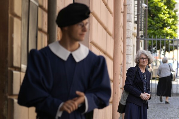 Sister Nathalie Becquart, right, poses for a photo as she enters Vatican City, May 29, 2023. (AP Photo/Alessandra Tarantino, File)