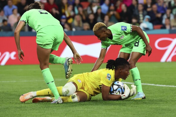 Nigeria's goalkeeper Chiamaka Nnadozie saves a ball during the Women's World Cup round of 16 soccer match between England and Nigeria in Brisbane, Australia, Monday, Aug. 7, 2023. (AP Photo/Tertius Pickard)