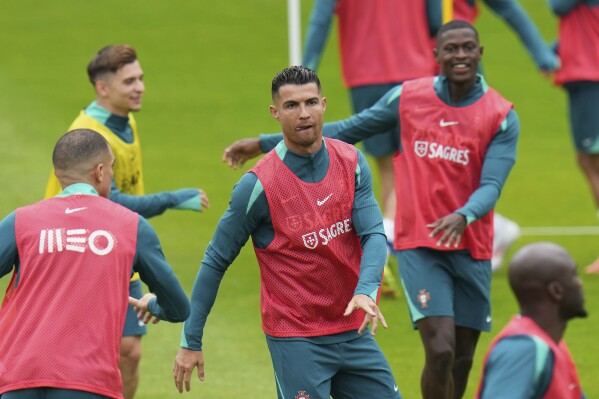 Portugal's Cristiano Ronaldo trains with his teammates during a training session in Gutersloh, Germany, Friday, June 14, 2024. Portugal will play against Czech Republic during their Group F soccer match at the Euro 2024 soccer tournament on June 18. (AP Photo/Hassan Ammar)