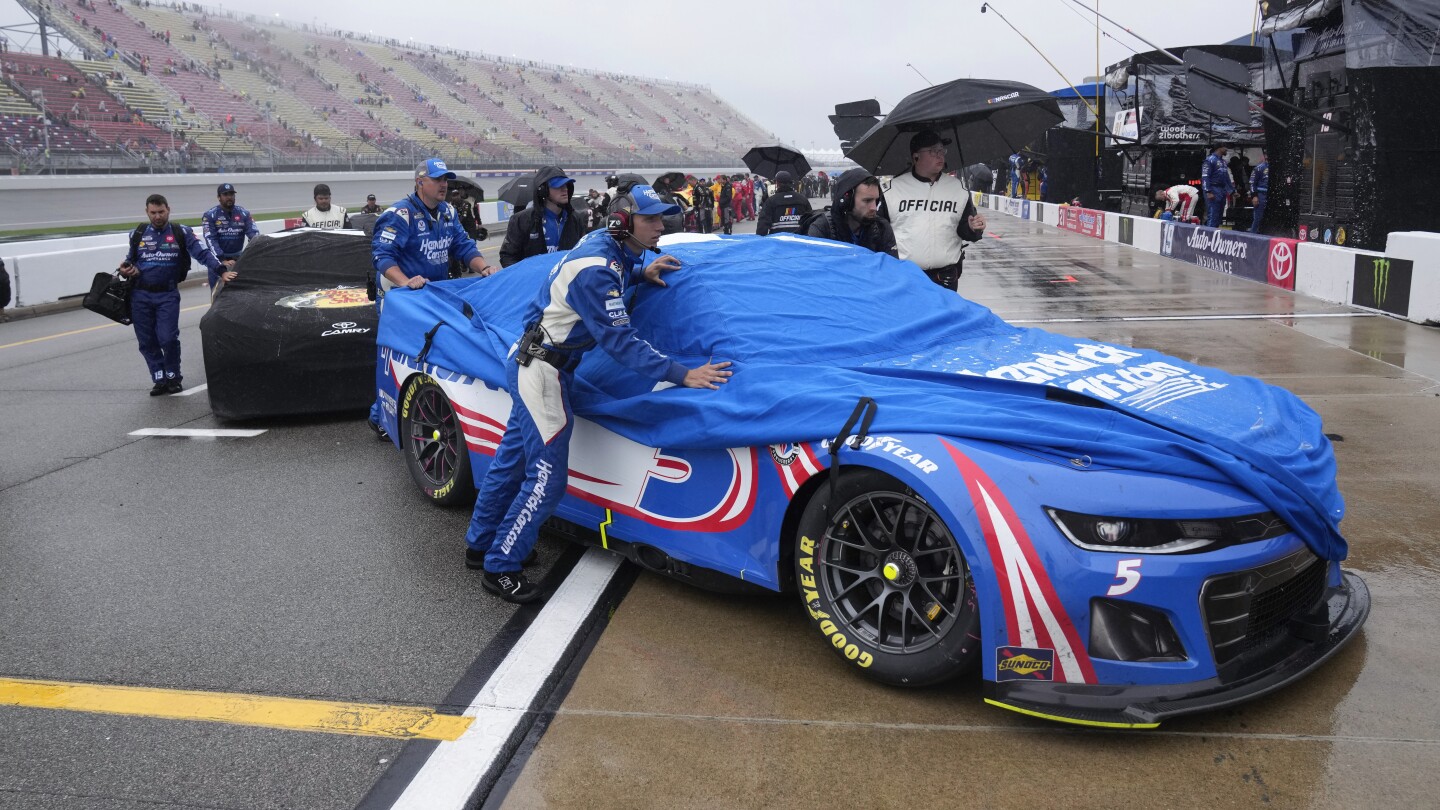 NASCAR suspends race at Michigan due to rain and aims to resume Monday