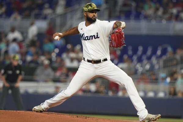 Miami Marlins starting pitcher Sandy Alcantara (22) winds a pitch during the first inning of a baseball game against the Atlanta Braves, Sunday, May 22, 2022, in Miami. (AP Photo/Marta Lavandier)