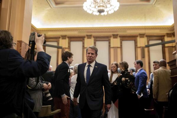 Gov. Brian Kemp makes his way through the House Chamber after speaking on Sine Die, the last day of the General Assembly at the Georgia State Capitol in Atlanta on Monday, April 4, 2022. (Branden Camp/Atlanta Journal-Constitution via AP)