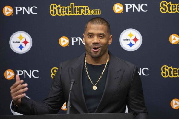 Pittsburgh Steelers newly-signed quarterback Russell Wilson speaks with reporters during an NFL football news conference in Pittsburgh, Friday, March 15, 2024, in Pittsburgh. Wilson signed a one-year deal with the Steelers after he was cut by the Denver Broncos. (AP Photo/Rebecca Droke)