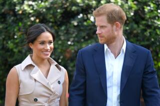 FILE - In this Oct. 2, 2019, file photo, Britain's Prince Harry and Meghan Markle appear at the Creative Industries and Business Reception at the British High Commissioner's residence in Johannesburg. Their first Netflix series will center on the Invictus Games, which gives sick and injured military personnel and veterans the opportunity to compete in sports. The Duke and Duchess of Sussex’s Archewell Productions announced Tuesday its first series to hit the streaming service. (Dominic Lipinski/Pool via AP, File)