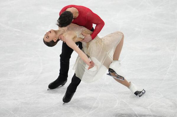 Gabriella Papadakis and Guillaume Cizeron, of France, perform their routine in the ice dance competition during the figure skating at the 2022 Winter Olympics, Monday, Feb. 14, 2022, in Beijing. (AP Photo/Natacha Pisarenko)