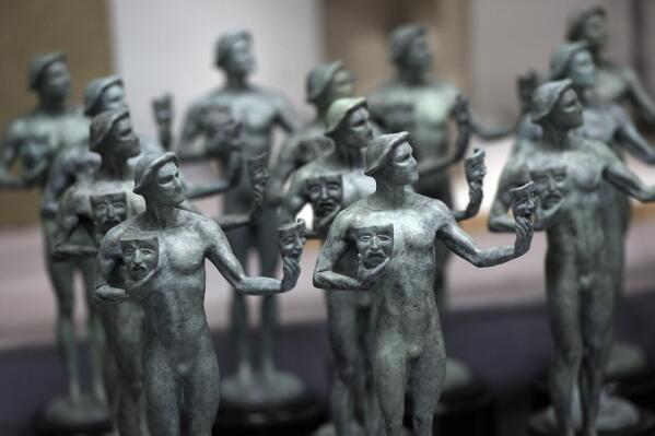 FILE - Finished solid bronze Actor statuettes are displayed during the 25th Annual Casting of the Screen Actors Guild Awards at American Fine Arts Foundry, Tuesday, Jan. 15, 2019, in Burbank, Calif.  The 2022 SAG Awards are scheduled to take place on Feb. 27. (Photo by Chris Pizzello/Invision/AP, File)