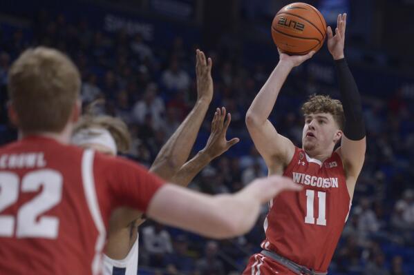 Wisconsin's Max Klesmit (11) pulls up to shoot against Penn State during the first half of an NCAA college basketball game, Wednesday, Feb. 8, 2023, in State College, Pa. (AP Photo/Gary M. Baranec)