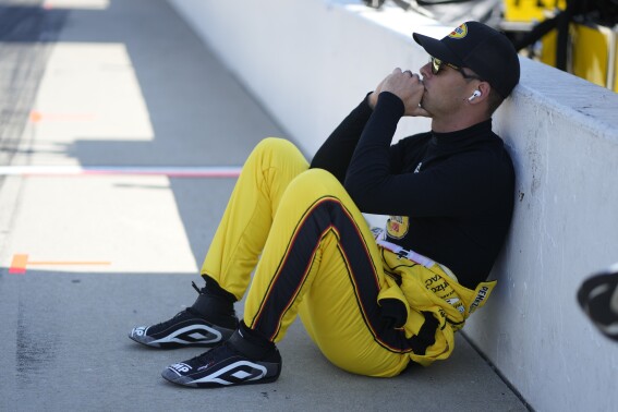 Scott McLaughlin, of New Zealand, sits along pit lane during qualifications for the Indianapolis 500 auto race at Indianapolis Motor Speedway, Saturday, May 18, 2024, in Indianapolis. (AP Photo/Darron Cummings)