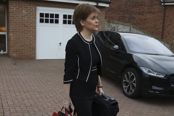 Scotland's First Minister Nicola Sturgeon, leaves her home, in Glasgow, Scotland, Tuesday, March 23, 2021. A Scottish parliamentary investigation says Sturgeon misled lawmakers about sexual harassment allegations against her predecessor. Lawmakers have been investigating the Scottish government’s handling of sexual harassment allegations against former First Minister Alex Salmond. A report published Tuesday says Sturgeon gave lawmakers “an inaccurate account of what happened” at a key meeting with Salmond in 2018 and "misled the committee on this matter.” (Andrew Milligan/PA via AP)