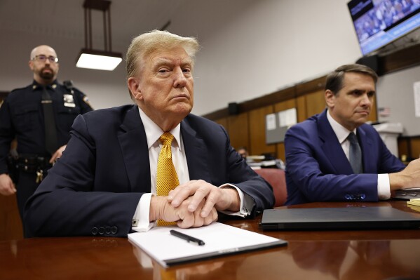 FILE - Former President Donald Trump sits in the courtroom for his trial at the Manhattan criminal court, Tuesday, May 21, 2024, in New York. As Trump attacked the U.S. criminal justice system following his guilty verdict, analysts say that his allegations could be useful to Russian President Vladimir Putin and other autocrats. (Michael M. Santiago/Pool Photo via AP, File)