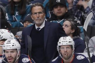 FILE - Columbus Blue Jackets coach John Tortorella watches the team play against the San Jose Sharks during an NHL hockey game in San Jose, Calif., Jan. 9, 2020. The Philadelphia Flyers have hired Tortorella as their new coach, hoping the veteran can help lead them to their first Stanley Cup since 1975. Tortorella coached Tampa Bay to a Stanley Cup title in 2004. He also coached the New York Rangers and Vancouver Canucks. He was fired in May 2021 after six seasons with the Blue Jackets.(AP Photo/Jeff Chiu, File)