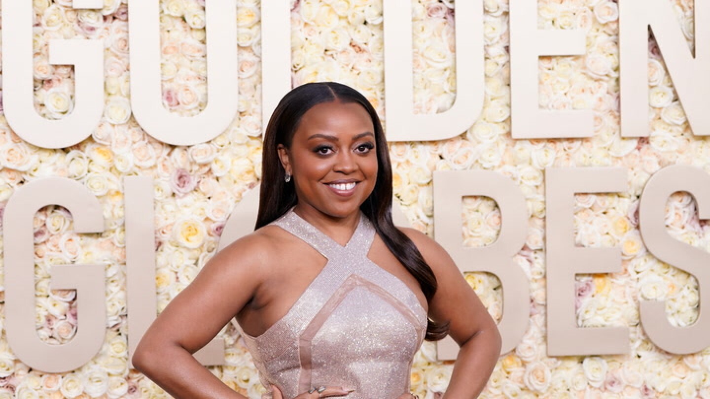 Quinta Brunson poses on the red carpet at the Golden Globes AP News