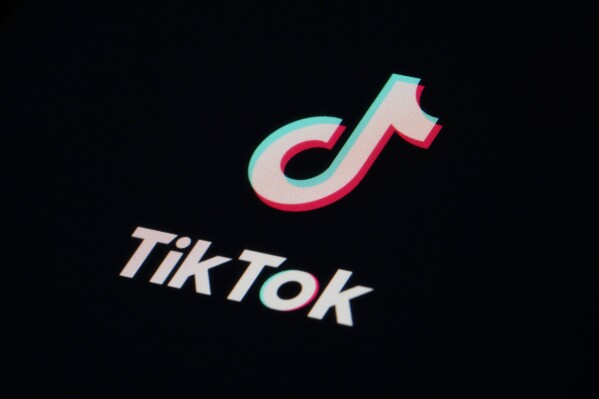 FILE - The icon for the video sharing TikTok app is seen on a smartphone, Feb. 28, 2023, in Marple Township, Pa. A trade group that represents TikTok and other major tech companies sued Utah on Monday, Dec. 18, over its first-in-the-nation laws requiring children and teens to obtain parental consent to use social media apps. (AP Photo/Matt Slocum, File)