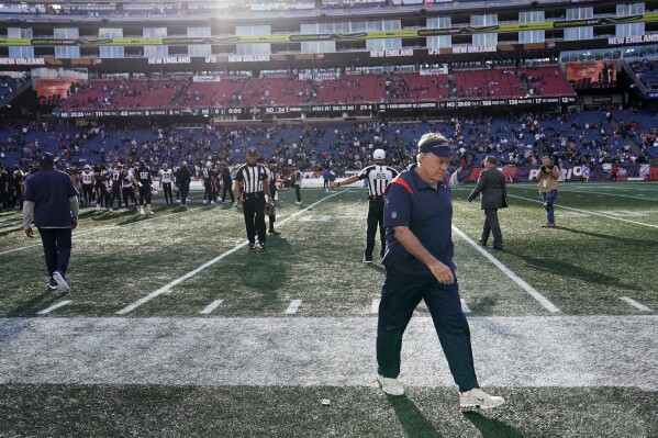 New England Patriots head coach Bill Belichich, right, steps off the field after his team's shutout loss to the New Orleans Saints in an NFL football game, Sunday, Oct. 8, 2023, in Foxborough, Mass. (AP Photo/Charles Krupa)
