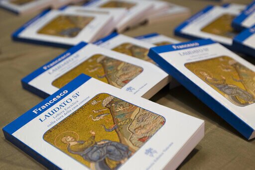 Copies of Pope Francis' encyclical "Laudato Si," (Praise Be) are displayed prior to the start of a press conference, at the Vatican, June 18, 2015. (AP Photo/Andrew Medichini, File)