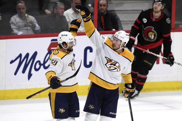 Nashville Predators center Ryan Johansen (92) celebrates his goal against the Ottawa Senators with defenseman Roman Josi (59) during the third period of an NHL hockey game Thursday, April 7, 2022 in Ottawa, Ontario. (Justin Tang/The Canadian Press via AP)