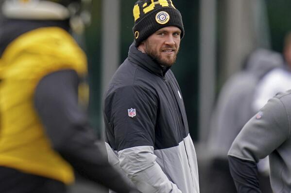 Steelers linebacker T.J. Watt watches from the sideline as his teammates practice during an NFL football practice, Friday, Nov. 19, 2021, in Pittsburgh. (Matt Freed/Pittsburgh Post-Gazette via AP)