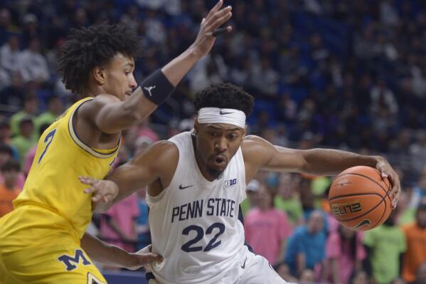 Penn State's Jalen Pickett (22) drives to the basket on Michigan's Kobe Bufkin during the first half of an NCAA college basketball game, Sunday, Jan. 29, 2023, in State College, Pa. (AP Photo/Gary M. Baranec)