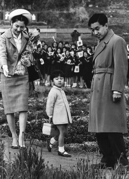 
              Crown Prince Naruhito, 4-years-old, center, takes a walk with Emperor Akihito and Empress Michiko during their tour to Wada in Chiba Prefecture, east of Tokyo, March 23, 1964, photo. When he abdicates April 30, 2019, Akihito will become the first emperor in Japan’s modern history to see his era end without ever having a war. (AP Photo)
            
