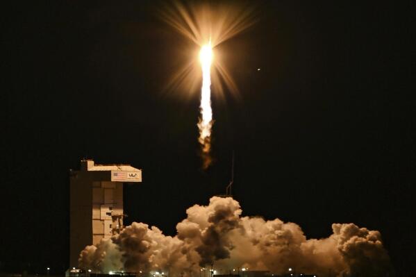 In this photo released by the U.S. Space Force, a United Launch Alliance Atlas V rocket carrying the Joint Polar Satellite System-2 satellite and the NASA test payload lifts off from Vandenberg Space Force Base, Calif., Thursday, Nov. 10, 2022. The satellite is intended to improve weather forecasting and an experimental inflatable heat shield to protect spacecraft entering atmospheres. (Ryan Quijas/U.S. Space Force via AP)