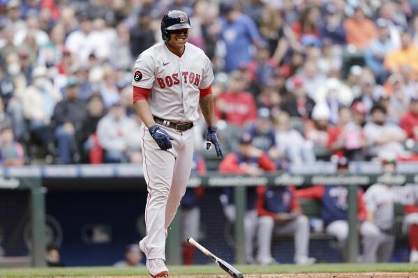 Rafael Devers of the Boston Red Sox reacts after hitting a double
