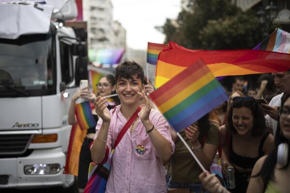 People participate in the annual Pride parade, in Athens, Saturday, June 10, 2023. June marks the beginning of Pride month in the U.S. and many parts of the world, a season intended to celebrate the lives and experiences of LGBTQ+ communities and to protest against attacks on hard-won civil rights gains. (AP Photo/Yorgos Karahalis)
