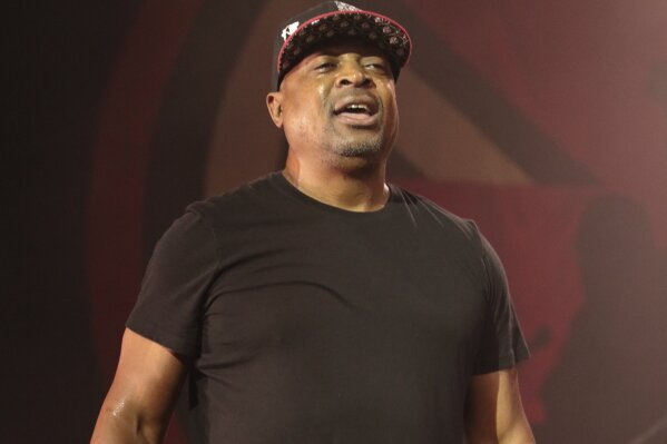 FILE - This Aug. 20, 2016 file photo shows Chuck D of the band Prophets of Rage performing during their "Make America Rage Again Tour" in Camden, N.J. Chuck D is this year’s winner of the Woody Guthrie Prize, an award that recognizes artists who speak out for the less fortunate. Chuck D was inducted into the Rock and Roll Hall of Fame in 2013 as part of the groundbreaking hip-hop group Public Enemy. He’ll be honored at a ceremony in Tulsa, Okla., on Nov. 16. (Photo by Owen Sweeney/Invision/AP, File)