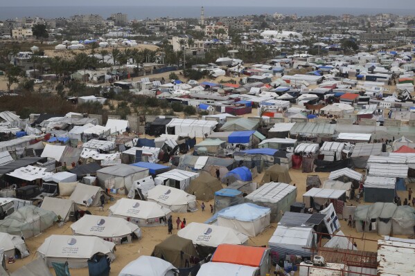 A tent camp housing Palestinians displaced by the Israeli offensive is seen in Rafah, Gaza Strip, Tuesday, Feb. 27, 2024. (AP Photo/Hatem Ali)