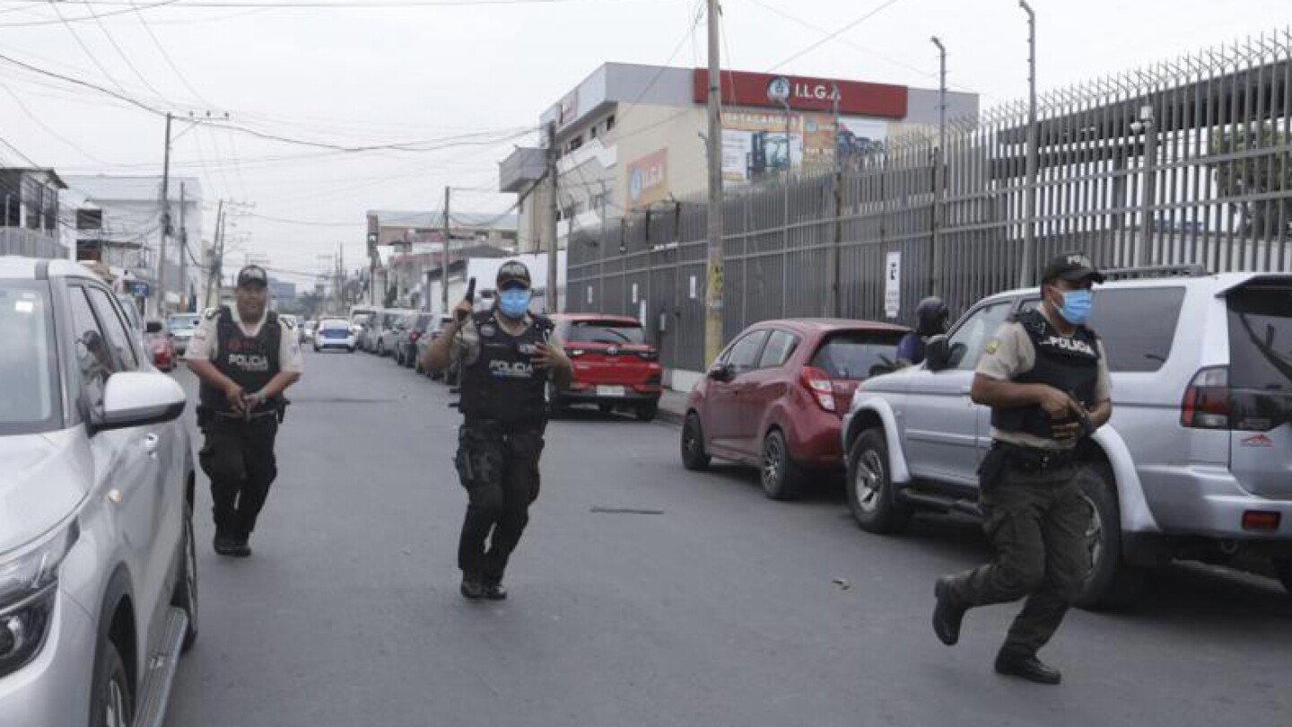 Armed males typhoon an Ecuador TV studio all through a reside broadcast as assaults within the nation escalate