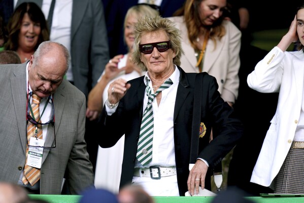 Singer Rod Stewart gestures, ahead of the Scottish Premiership soccer match between Glasgow Rangers and Celtic Glasgow, at the Celtic park, Glasgow, Scotland, Saturday, May 11, 2024. (Jane Barlow/PA via AP)