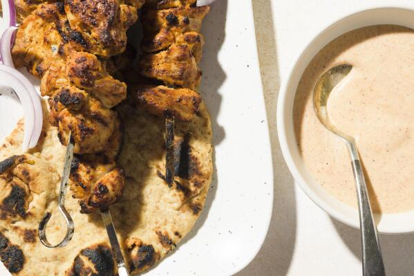 This image released by Milk Street shows a recipe for tandoori-inspired chicken kebabs. (Milk Street via AP)
