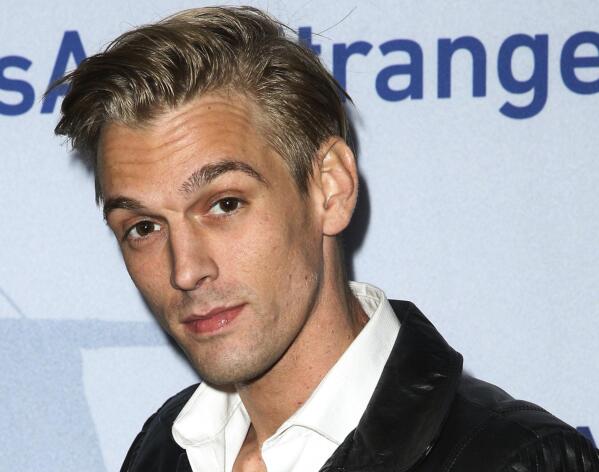 FILE - Singer Aaron Carter arrives at a premiere of "Saints & Strangers" at the Saban Theater in Beverly Hills, Calif., Nov. 9, 2015. Carter accidentally drowned in his bathtub due to sedatives he'd taken and gas used in spray cleaners he had inhaled, a coroner's report said Tuesday. The singer-rapper who began performing as a child and had hit albums starting in his teen years, was found dead Nov. 5, 2022, at his home in Southern California. He was 34. (Photo by Rich Fury/Invision/AP, File)