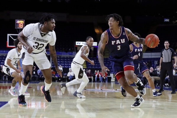 Florida Atlantic's Giancarlo Rosado (3) drives past St. Bonaventure's Chad Venning (32) during the first half of an NCAA college basketball game in the Basketball Hall of Fame Classic, Saturday, Dec. 16, 2023, in Springfield, Mass.(AP Photo/Michael Dwyer)