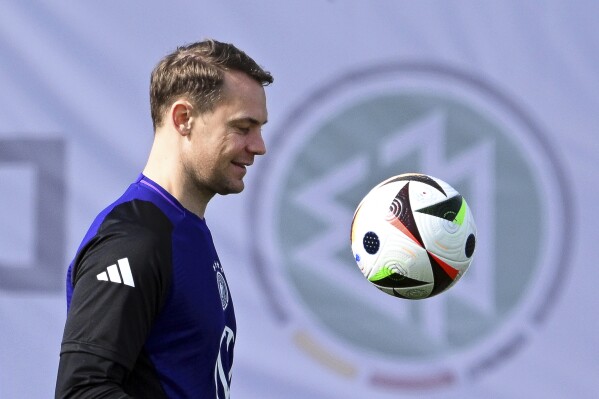 Germany's goalkeeper Manuel Neuer takes part in a training session in Frankfurt, Germany, Wednesday, March 20, 2024, ahead of the international soccer friendly match against France. Neuer has been ruled out of the team’s friendlies against France and the Netherlands with a thigh injury. The Bayern Munich goalkeeper left the team camp Wednesday with a muscle fiber tear in his left adductor sustained in training that morning, the German soccer federation said. (Arne Dedert/dpa via AP)