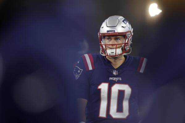 New England Patriots quarterback Mac Jones (10) stands on the sidelines on an offensive drive during the second half of an NFL football game against the Chicago Bears, Monday, Oct. 24, 2022, in Foxborough, Mass. (AP Photo/Michael Dwyer)
