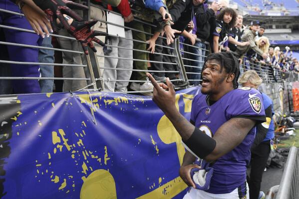Baltimore Ravens quarterback Lamar Jackson talks to fans after an NFL football game against the Los Angeles Chargers, Sunday, Oct. 17, 2021, in Baltimore. The Ravens won 34-6. (AP Photo/Nick Wass)